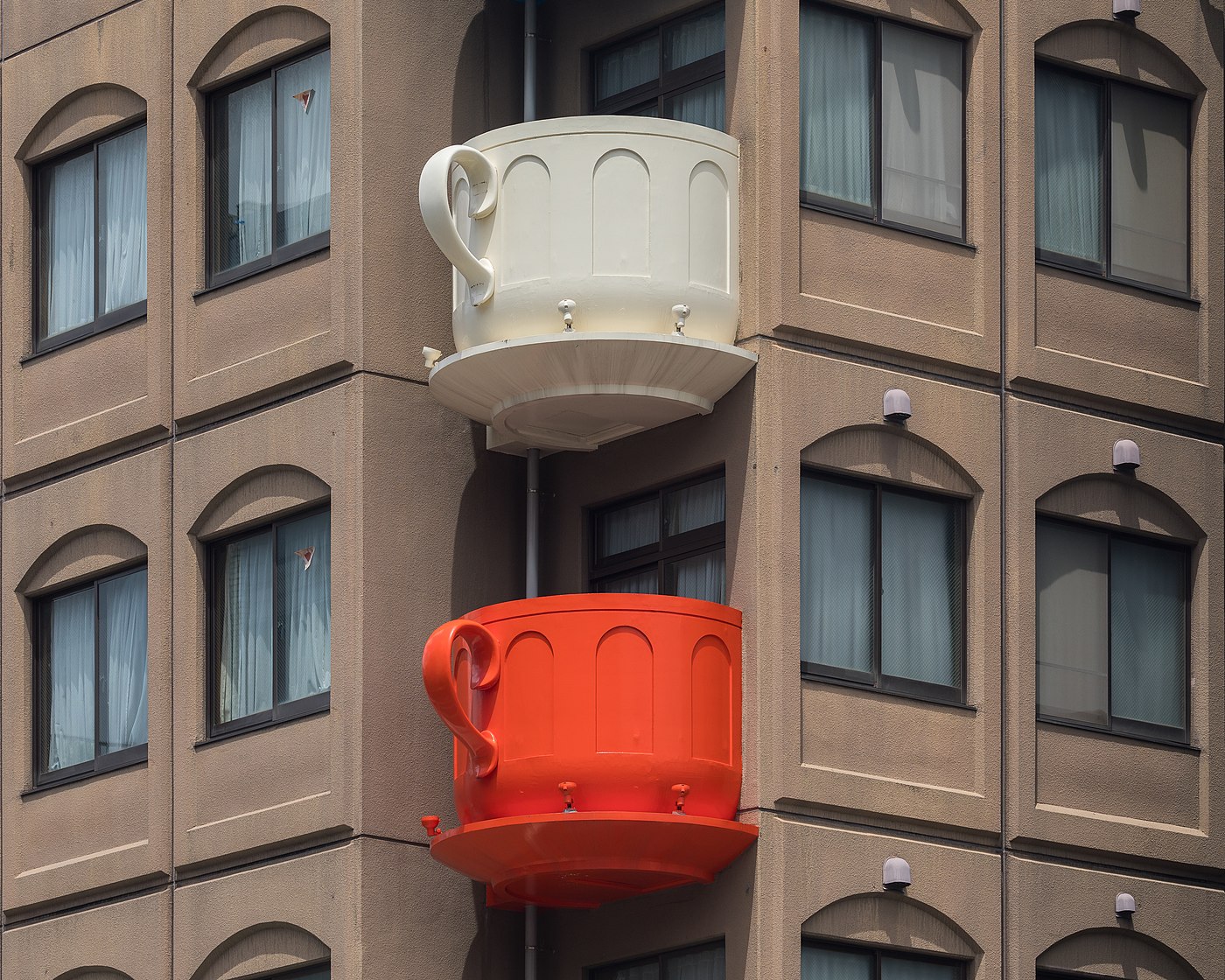 Cream and red coffee cup-shaped balconies Kappabashi, Tokyo